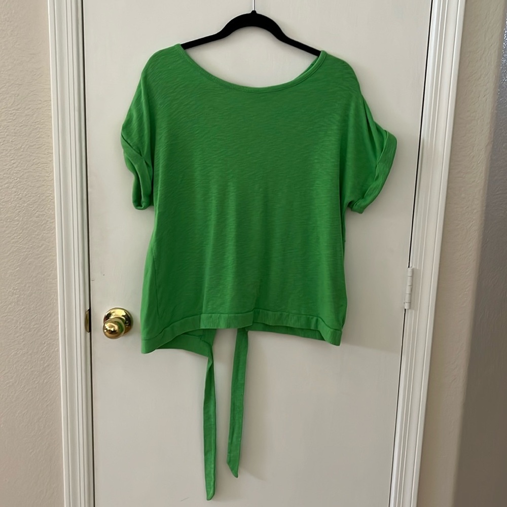Green stretchy cotton short sleeved sweater with open back tie detail